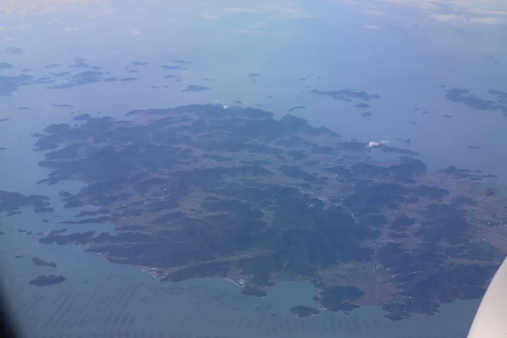 An aerial view shows Jindo’s mountains, fields and branching coast surrounded by smaller islands.